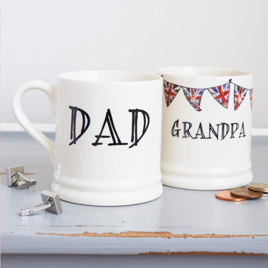 Ceramic Dad and Grandpa mugs with hand-drawn Union Jack bunting, displayed together as thoughtful Father’s Day gifts