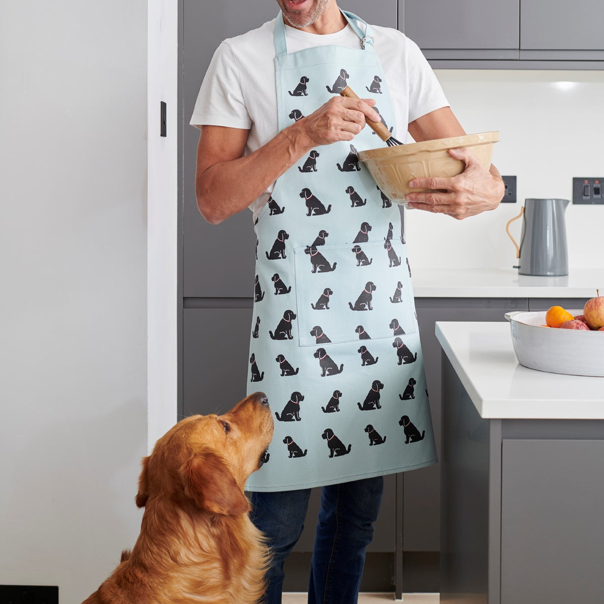 Black Cockapoo apron worn in the kitchen — organic cotton dog lover gift by Sweet William Designs
