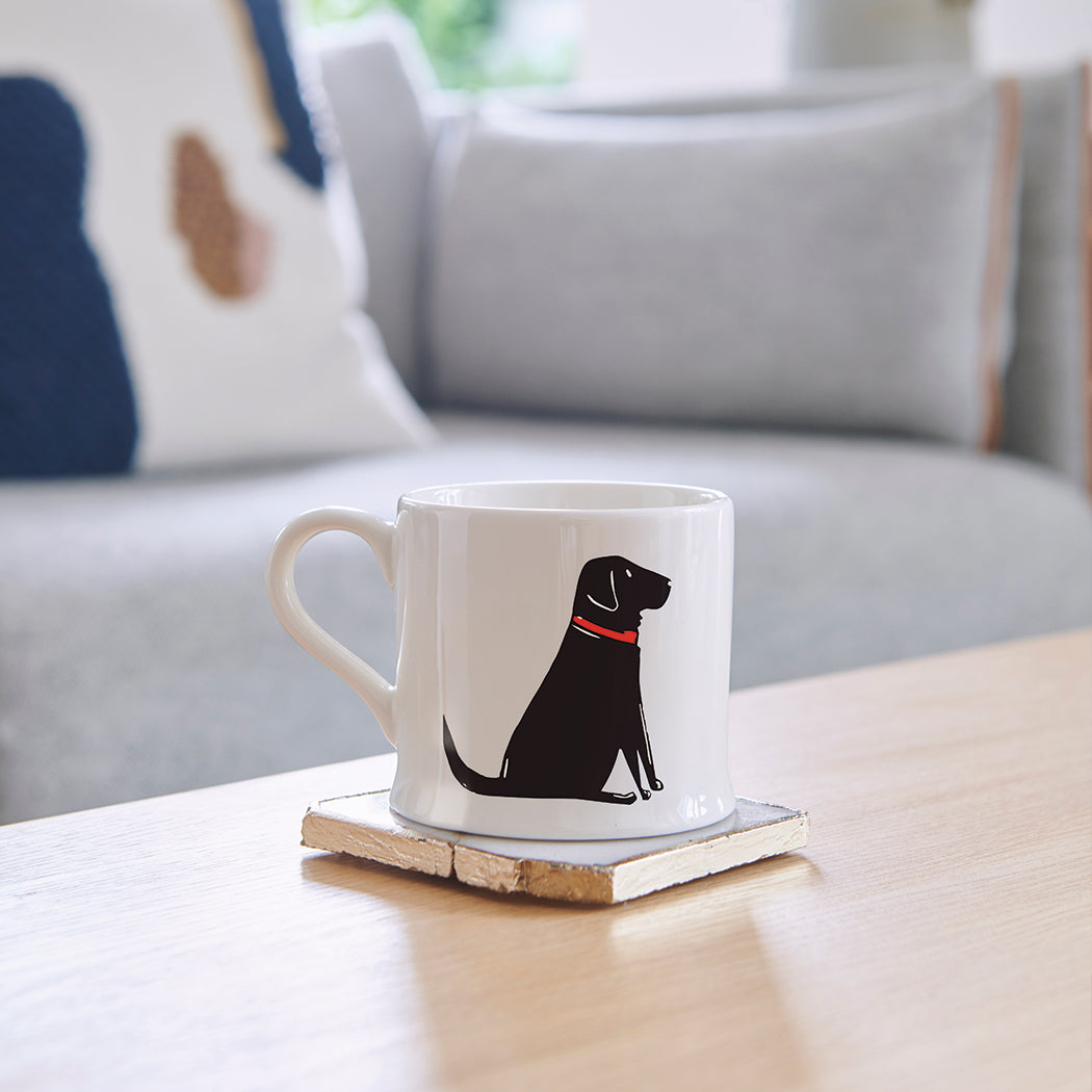 Single Black Labrador mug on a coffee table — ceramic dog lover gift by Sweet William Designs