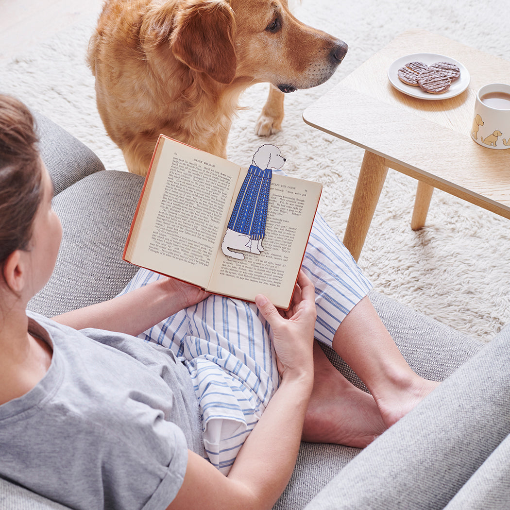 Woman reading a book with an Apricot Cockapoo / Labradoodle bookmark and matching Apricot Cockapoo / Labradoodle mug by Sweet William Designs
