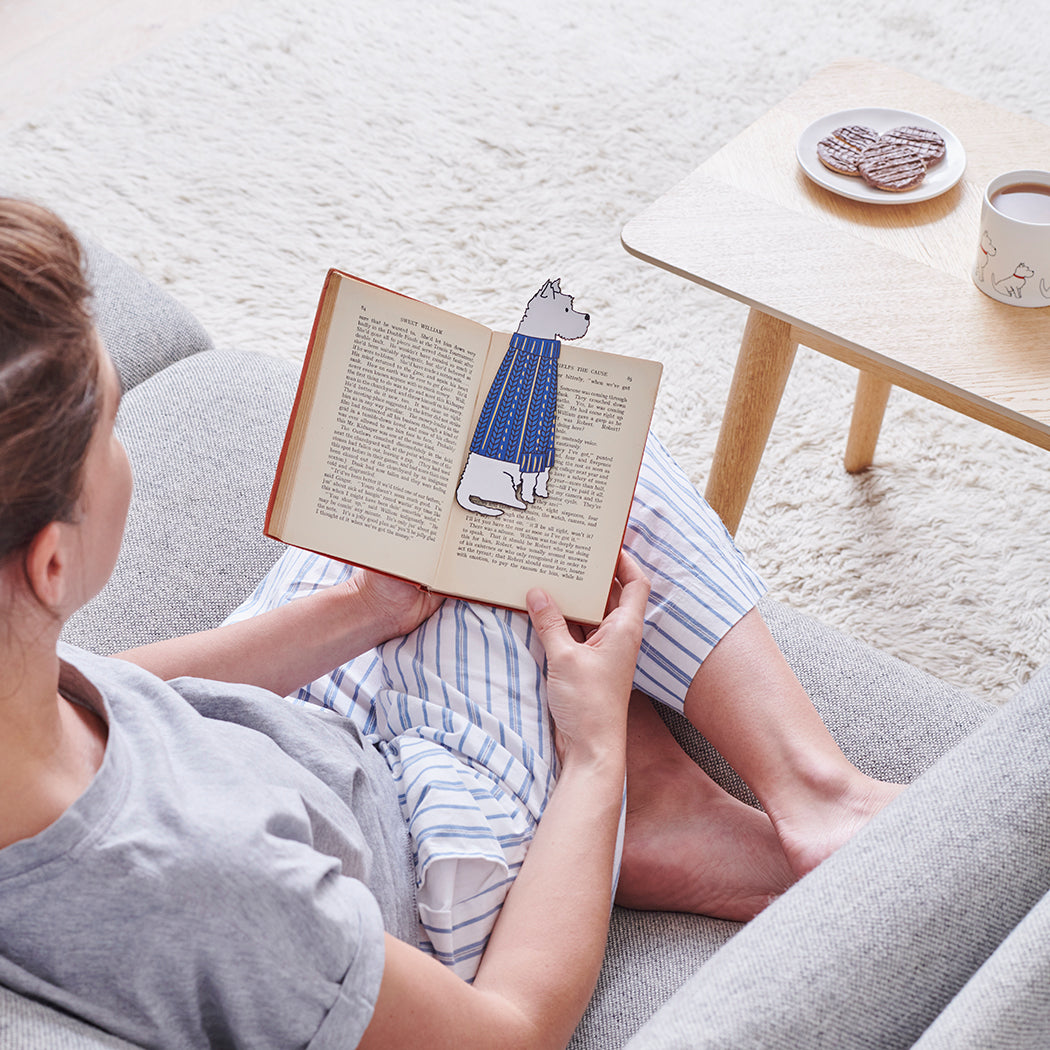 Woman reading a book with a Westie bookmark and matching Westie mug by Sweet William Designs