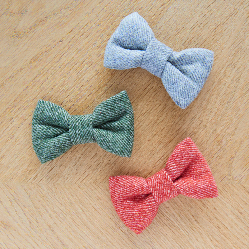 Green, grey and orange tweed dog bow ties displayed together, perfect for smart walks and special occasions