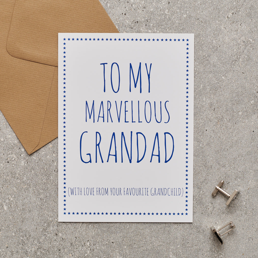 White Grandad card with blue lettering reading “To My Marvellous Grandad” and “With love from your favourite grandchild”, a blue star border, kraft envelope and silver cufflinks.