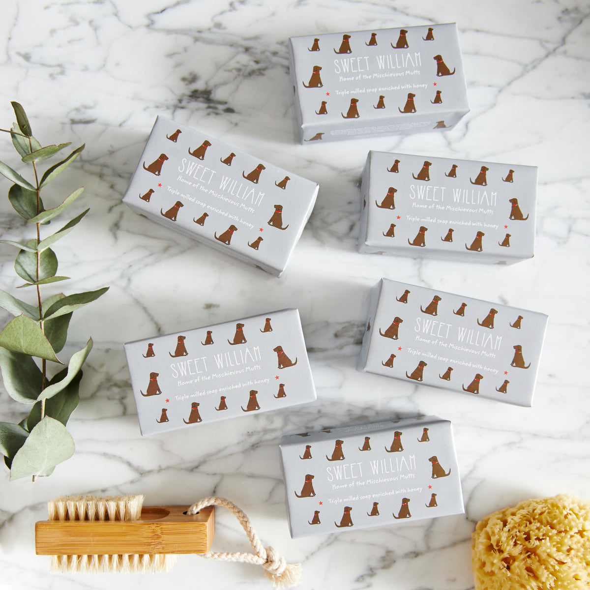 Collection of Chocolate Labrador triple milled soaps on marble surface — honey-enriched luxury dog lover gift by Sweet William Designs