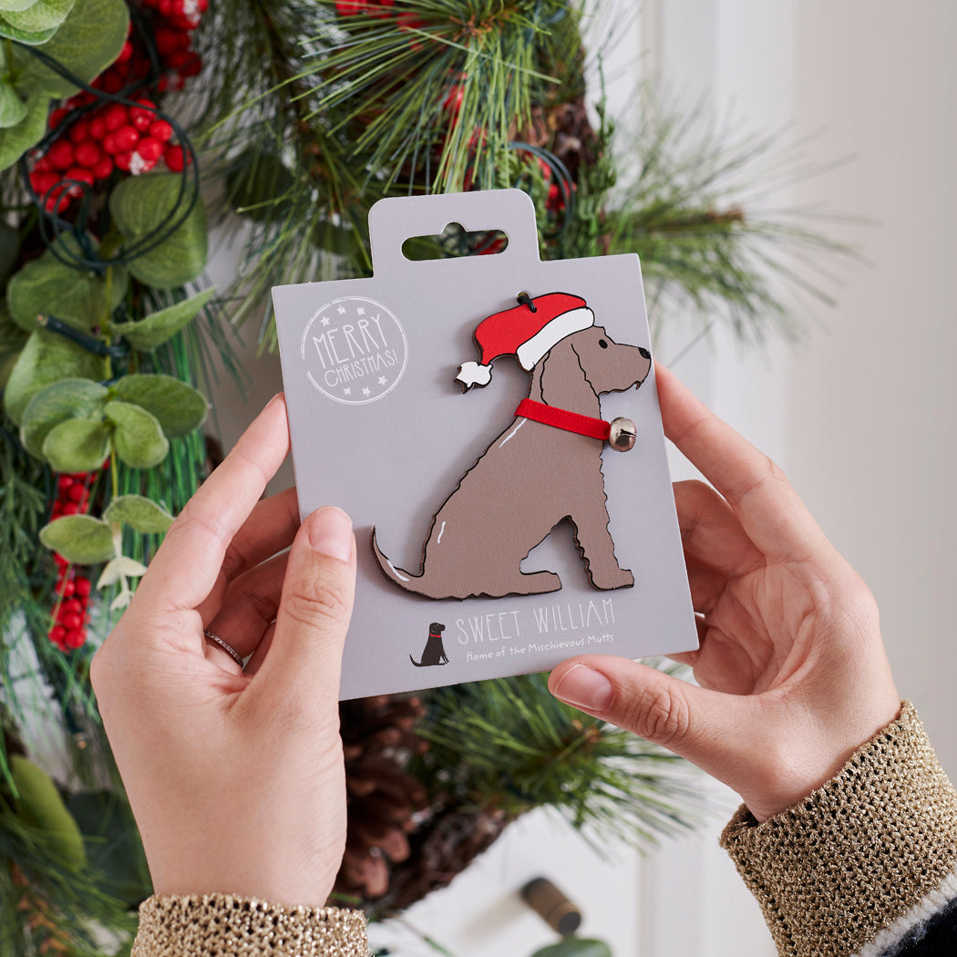 Chocolate Cocker Spaniel Christmas tree decoration held in hands on backing card — Father Christmas hat and jingle bell collar, dog lover gift by Sweet William Designs