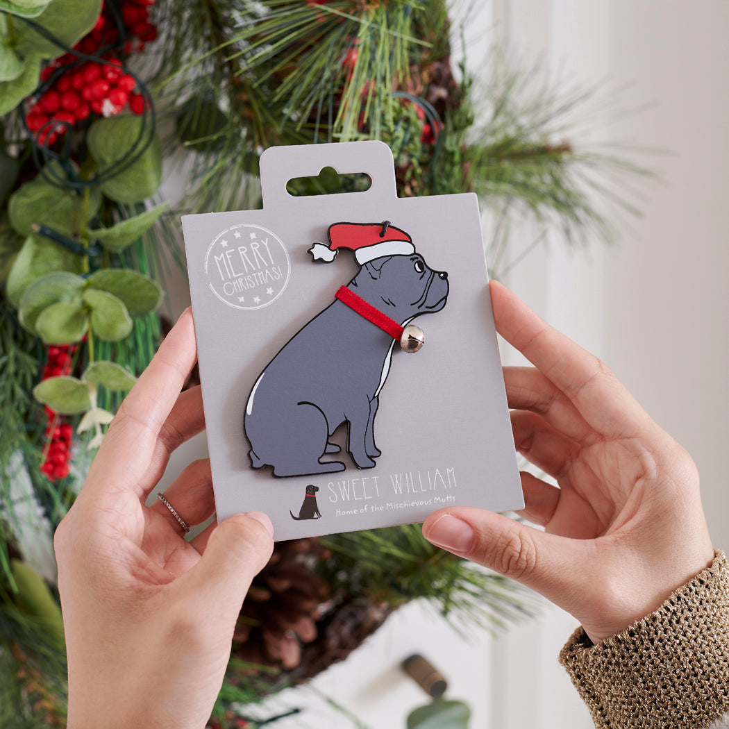 French Bulldog Christmas tree decoration held in hands on backing card — Father Christmas hat and jingle bell collar, dog lover gift by Sweet William Designs