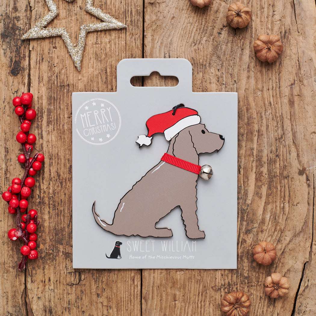 Chocolate Cocker Spaniel Christmas decoration on backing card — wooden dog decoration with Father Christmas hat and jingle bell collar, festive dog lover gift by Sweet William Designs