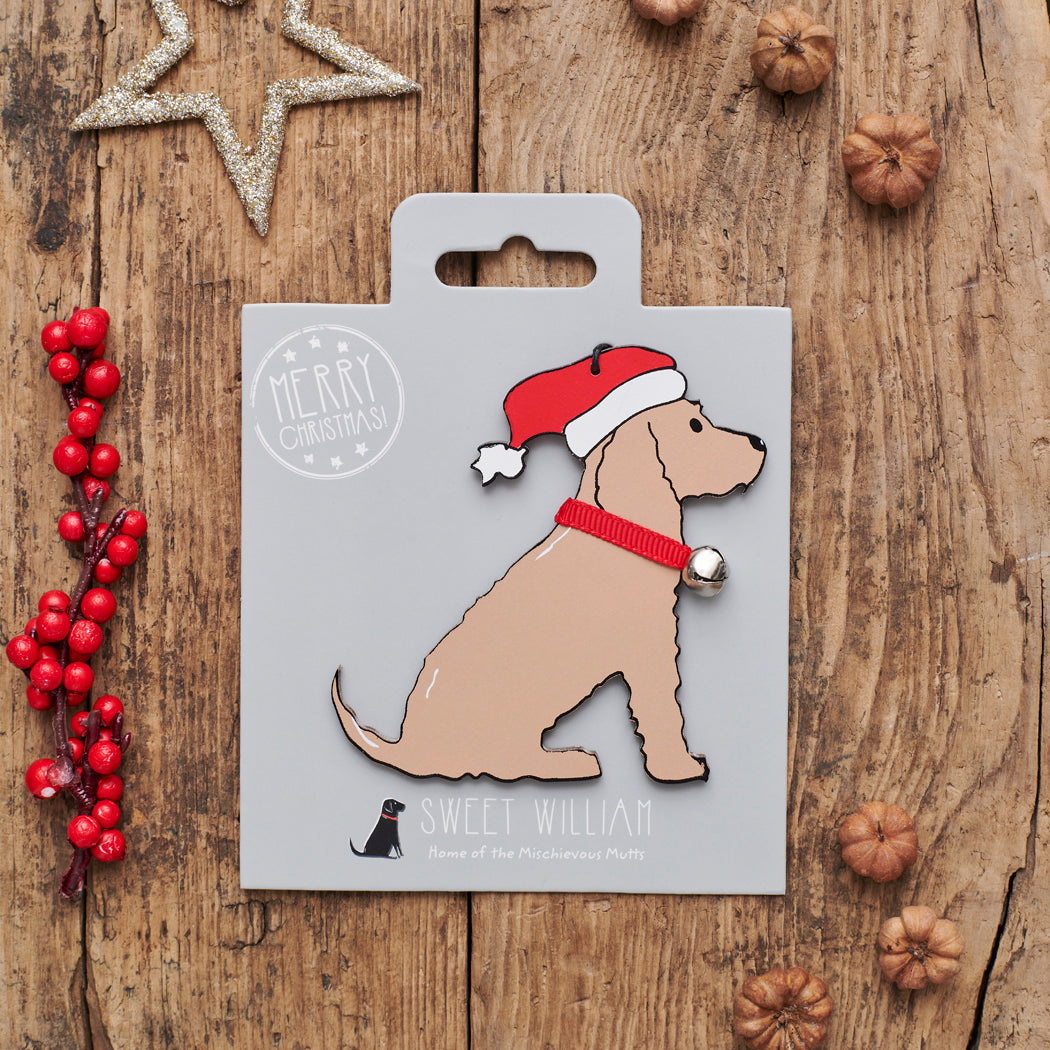 Golden Cocker Spaniel Christmas decoration on backing card — wooden dog decoration with Father Christmas hat and jingle bell collar, festive dog lover gift by Sweet William Designs