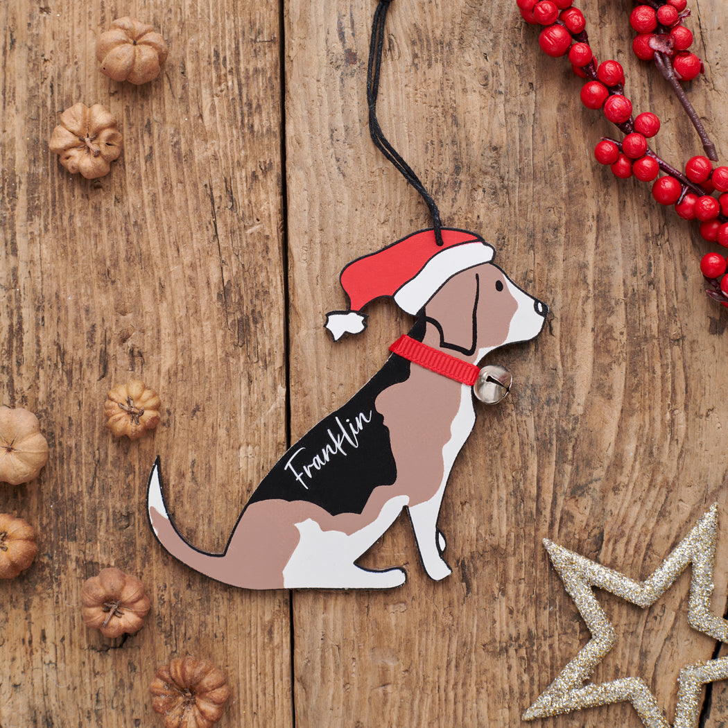 Personalised Beagle Christmas decoration with name — wooden dog decoration with Father Christmas hat and jingle bell collar, thoughtful dog lover gift by Sweet William Designs
