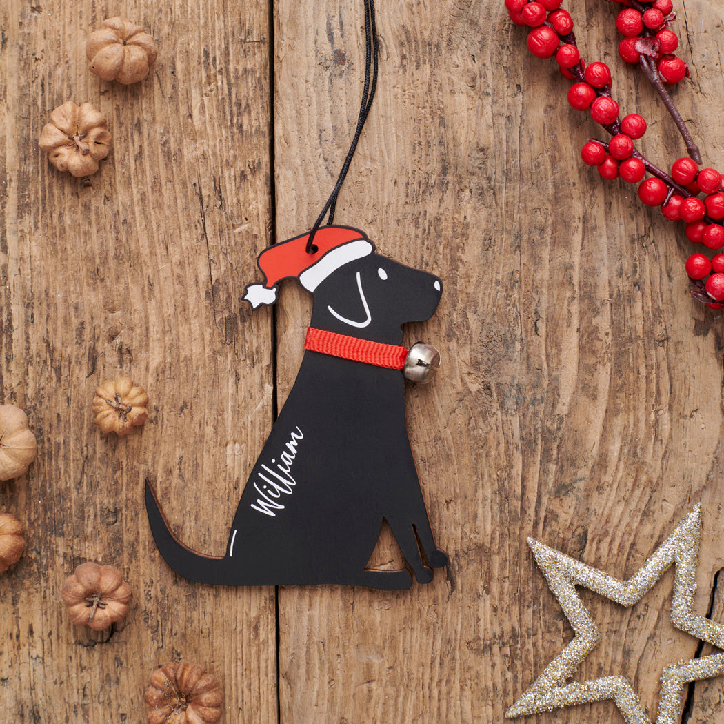 Personalised Black Labrador Christmas decoration with name — wooden dog decoration with Father Christmas hat and jingle bell collar, thoughtful dog lover gift by Sweet William Designs