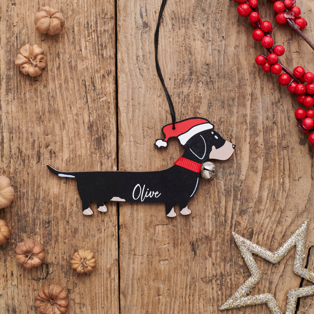 Personalised Dachshund Christmas decoration with name — wooden dog decoration with Father Christmas hat and jingle bell collar, thoughtful dog lover gift by Sweet William Designs