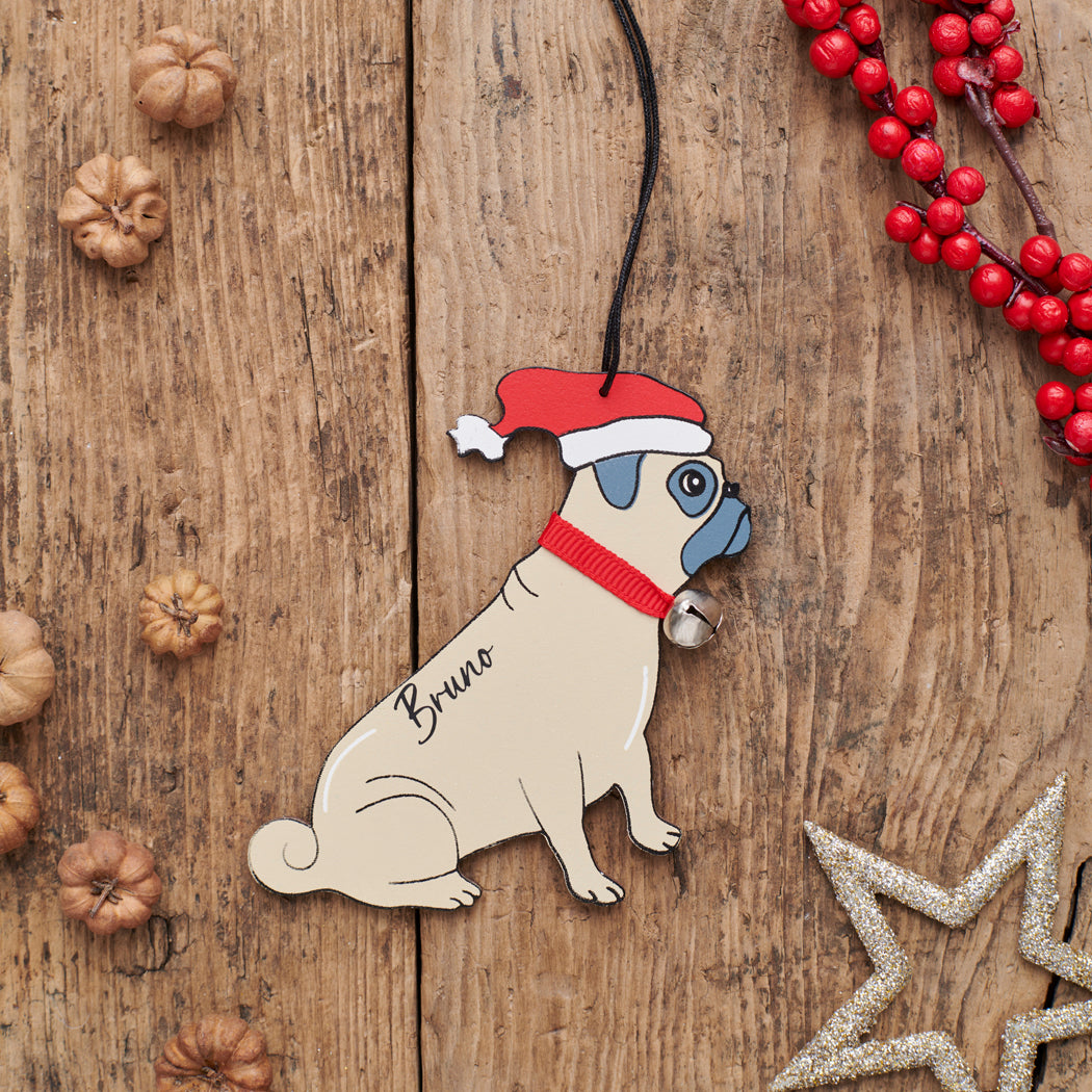 Personalised Pug Christmas decoration with name — wooden dog decoration with Father Christmas hat and jingle bell collar, thoughtful dog lover gift by Sweet William Designs