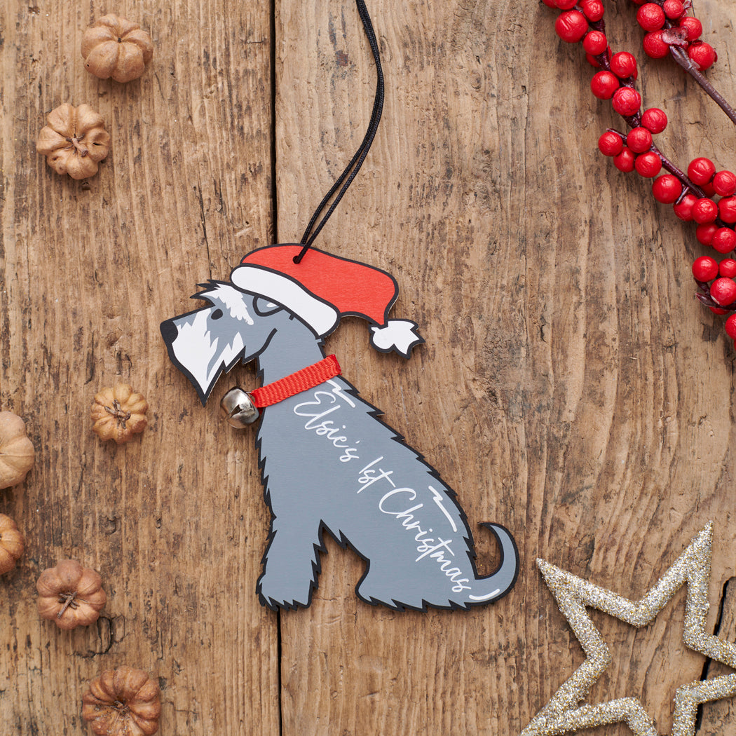Personalised Grey Schnauzer Christmas decoration with custom message — wooden dog decoration with Father Christmas hat and jingle bell collar by Sweet William Designs