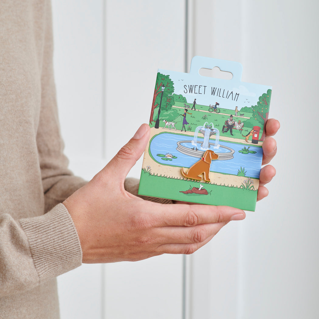 Golden Cocker Spaniel enamel dog pin held in hands on illustrated park backing card — gold-plated dog lover gift by Sweet William Designs