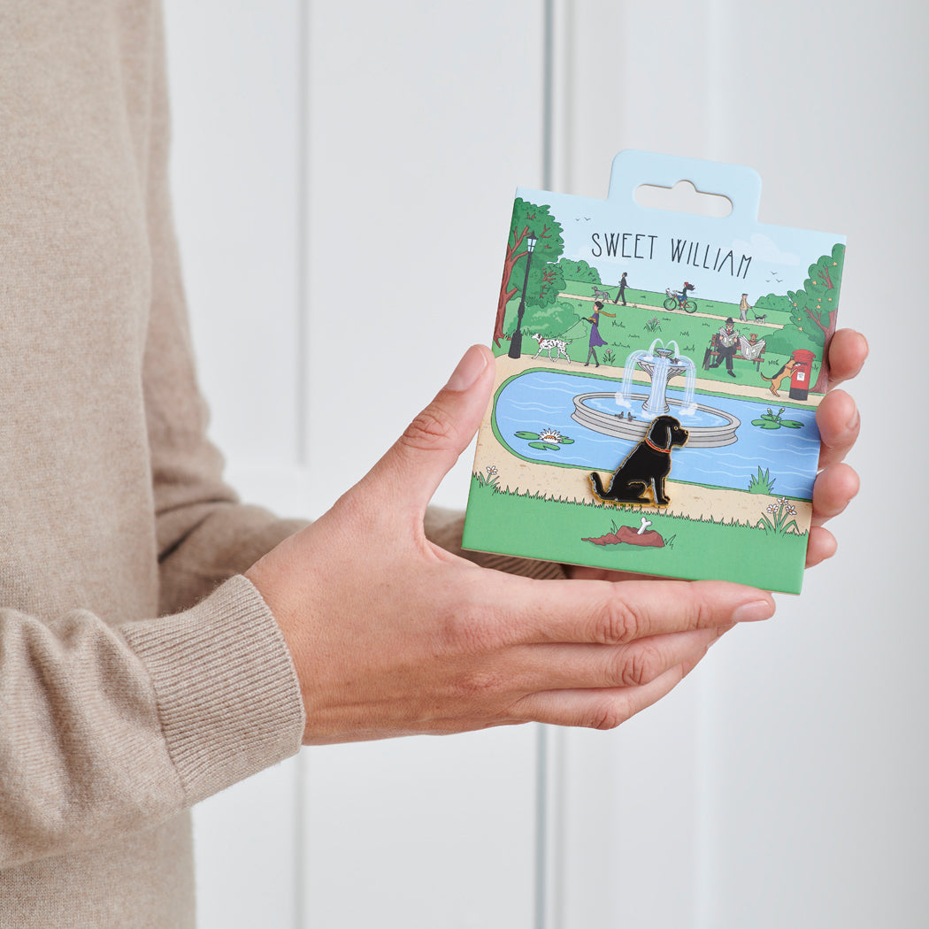Black Cockapoo / Labradoodle enamel dog pin held in hands on illustrated park backing card — gold-plated dog lover gift by Sweet William Designs