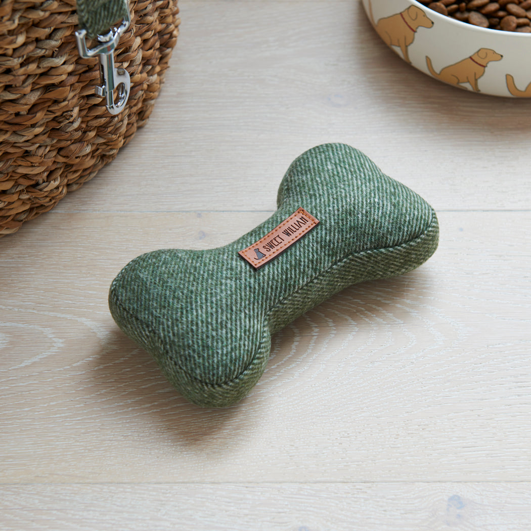 Close-up of the green tweed dog bone toy with a matching Sweet William lead and Golden Retriever dog bowl, lovely gifts for the dog
