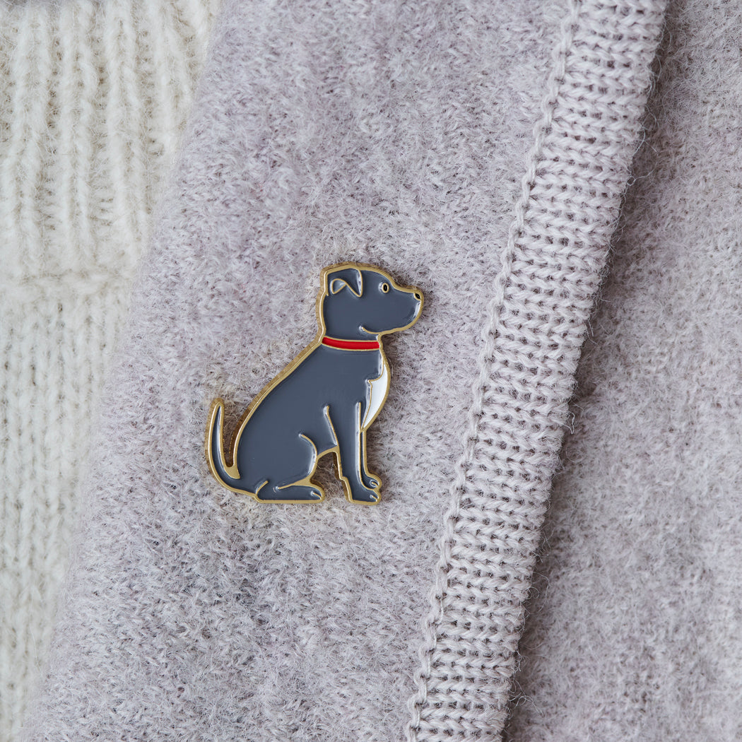Close-up of Staffie enamel pin attached to a wool jacket collar — gold-plated dog pin, Christmas gift for Staffie lovers
