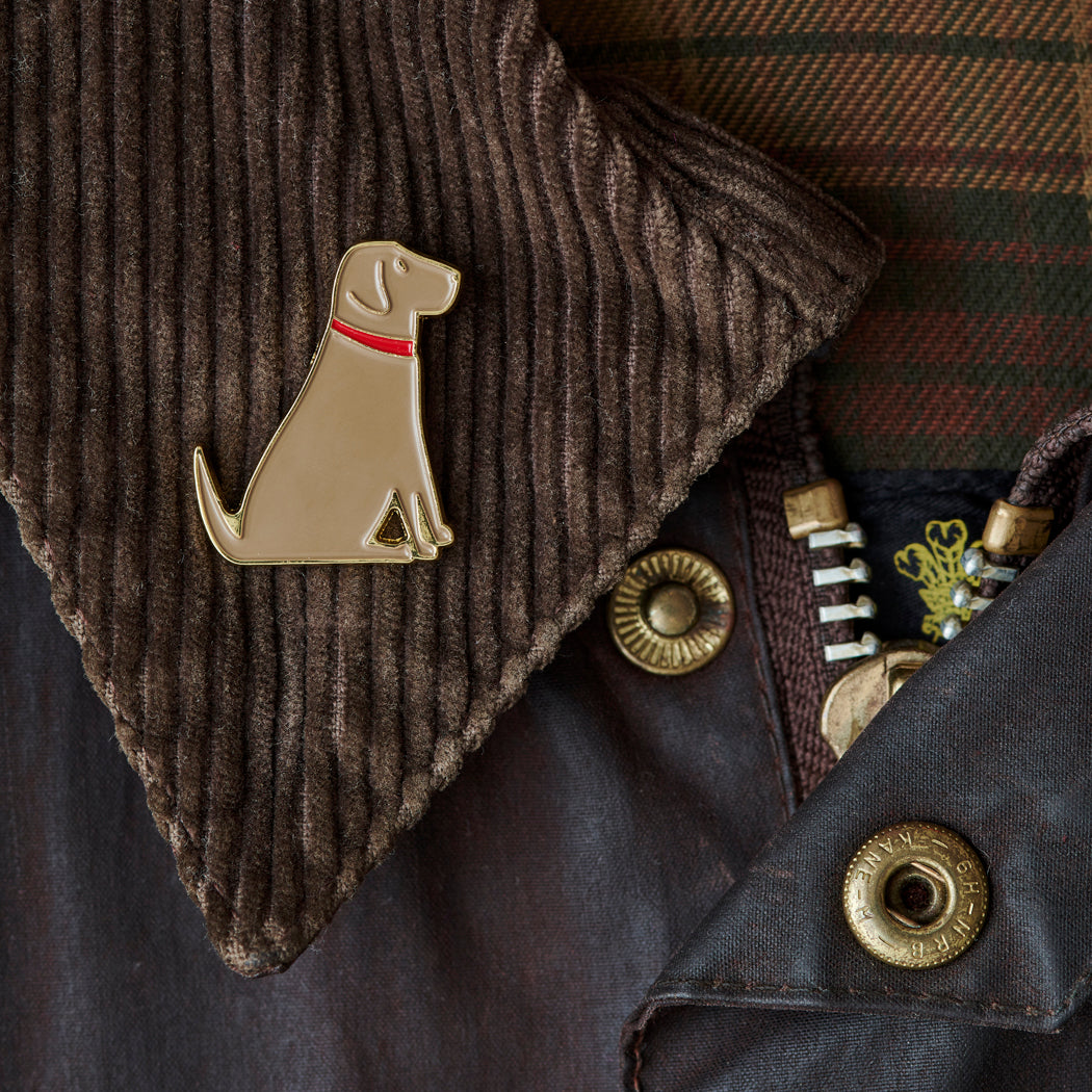 Close up of Yellow Labrador enamel pin attached to a corduroy jacket collar — gold-plated dog pin, perfect gift for dog lovers