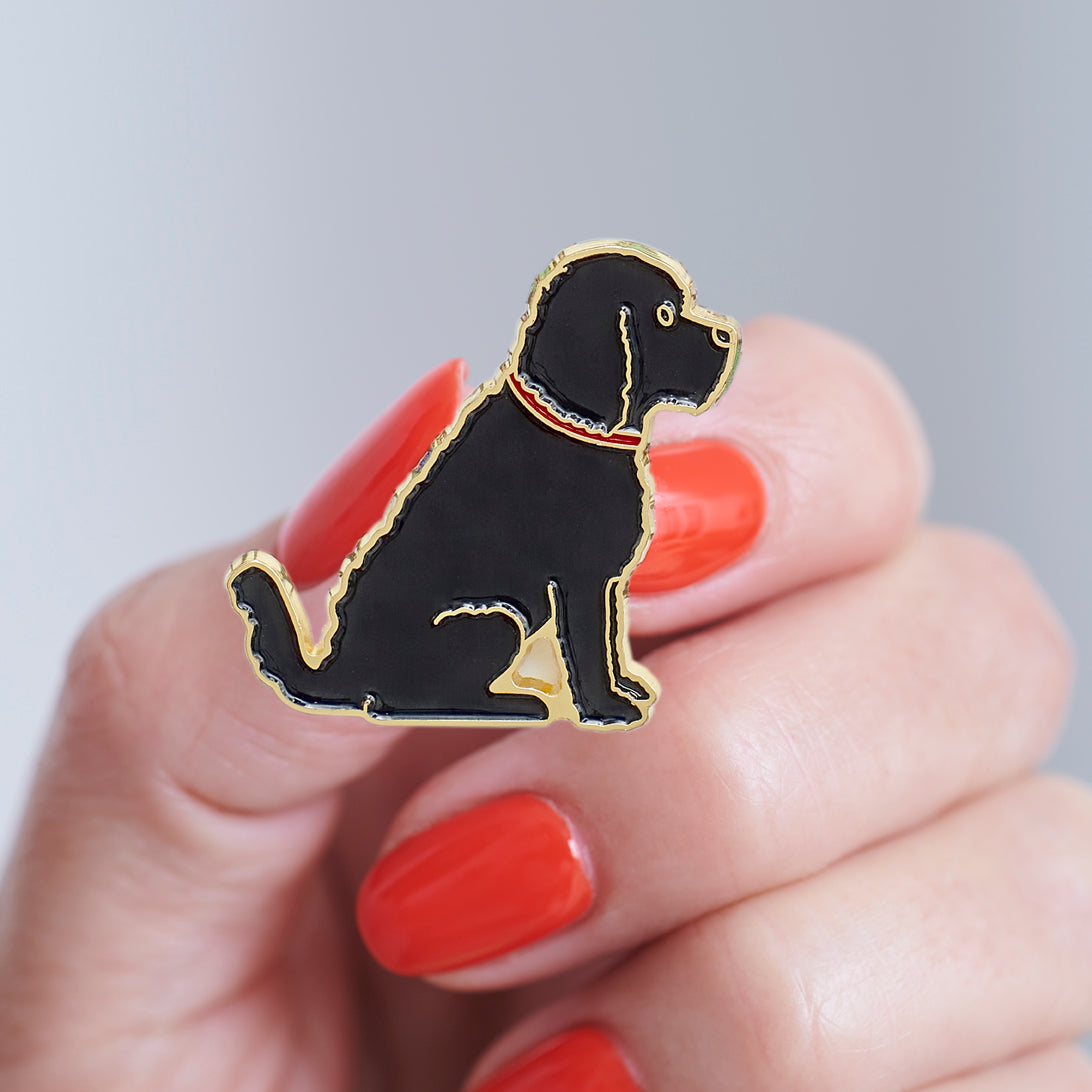 Close-up of Black Cockapoo / Labradoodle enamel pin held in hand, showing the detailed Cockapoo / Labradoodle dog design by Sweet William Designs