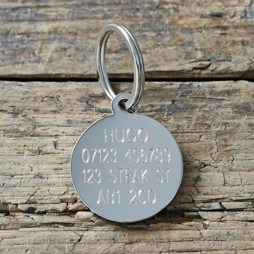 Reverse side of personalised dog ID tag — engraved with dog’s name, address and postcode, made from solid silver-plated brass by Sweet William Designs