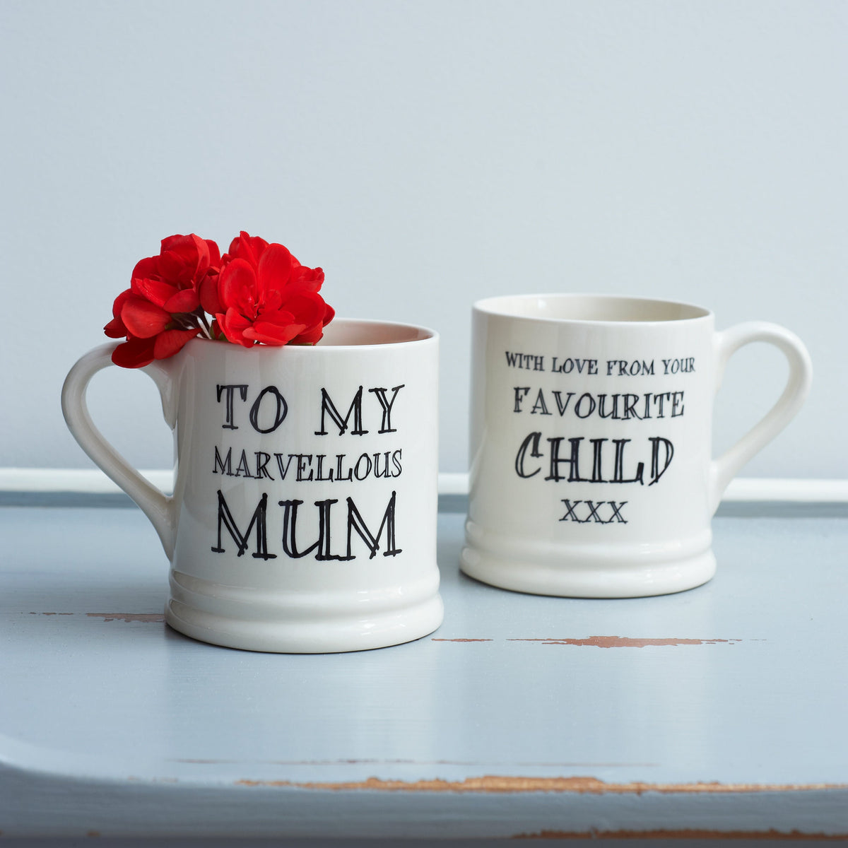 Ceramic Mum mug showing “To My Marvellous Mum” on the front and “With Love From Your Favourite Child xxx” on the reverse, a funny gift by Sweet William Designs