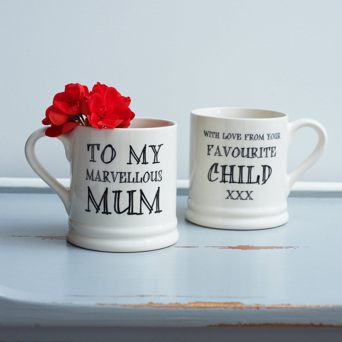 Ceramic Mum mug showing “To My Marvellous Mum” on the front and “With Love From Your Favourite Child xxx” on the reverse, a funny gift by Sweet William Designs