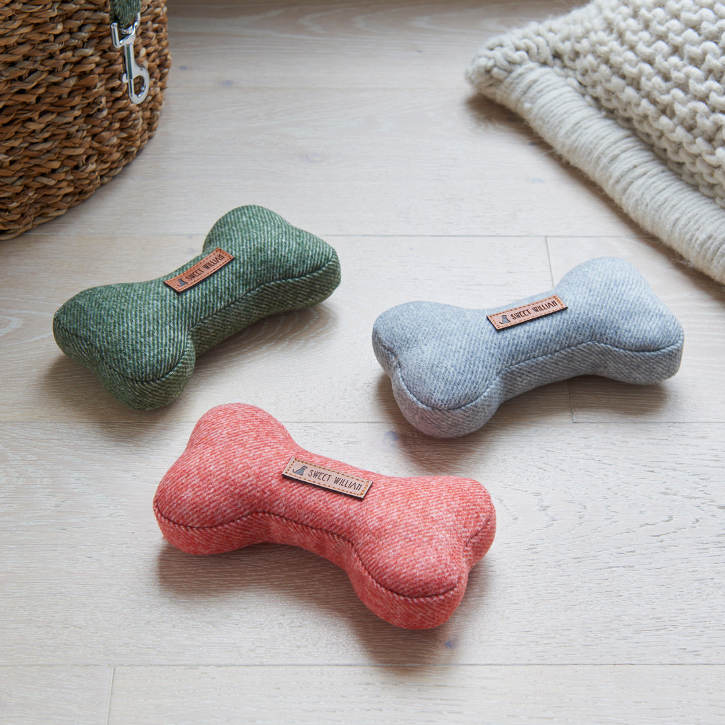 Green, grey and orange tweed dog bone toys by Sweet William, a perfect gift for the dog who loves to play