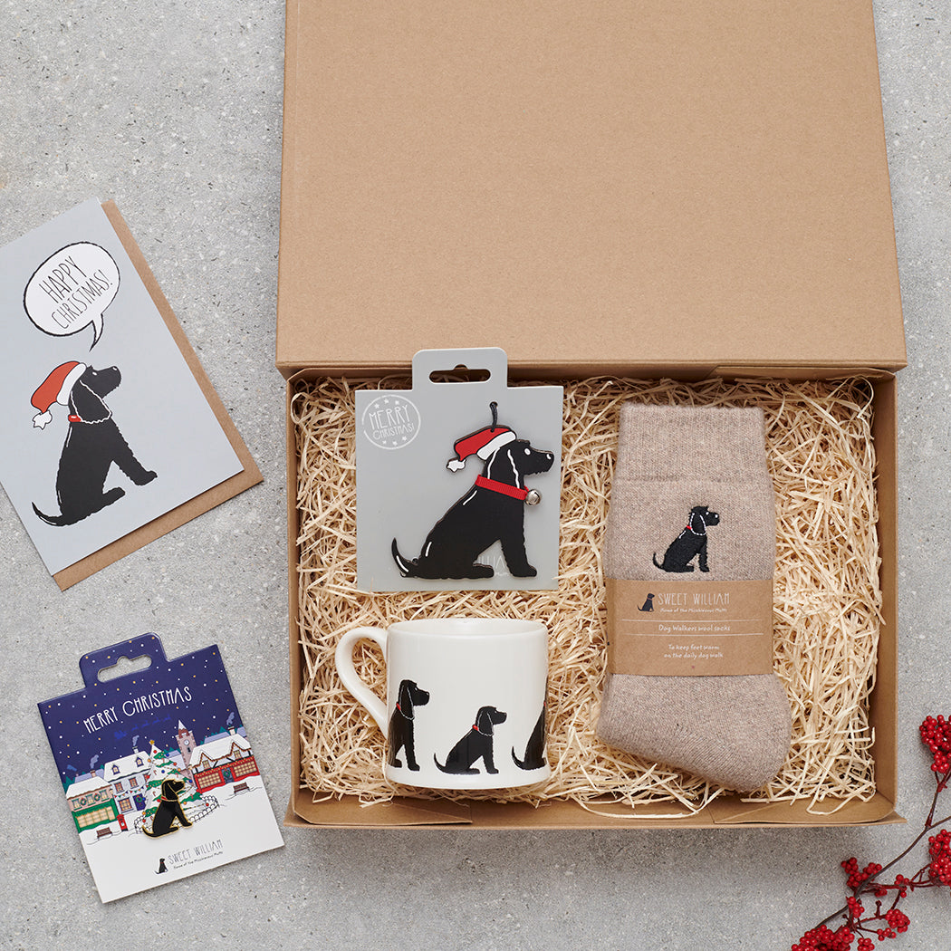 Black Cocker Spaniel Christmas gift hamper with a matching Black Cocker Spaniel Christmas pin, socks, mug, Christmas decoration and greeting card by Sweet William Designs