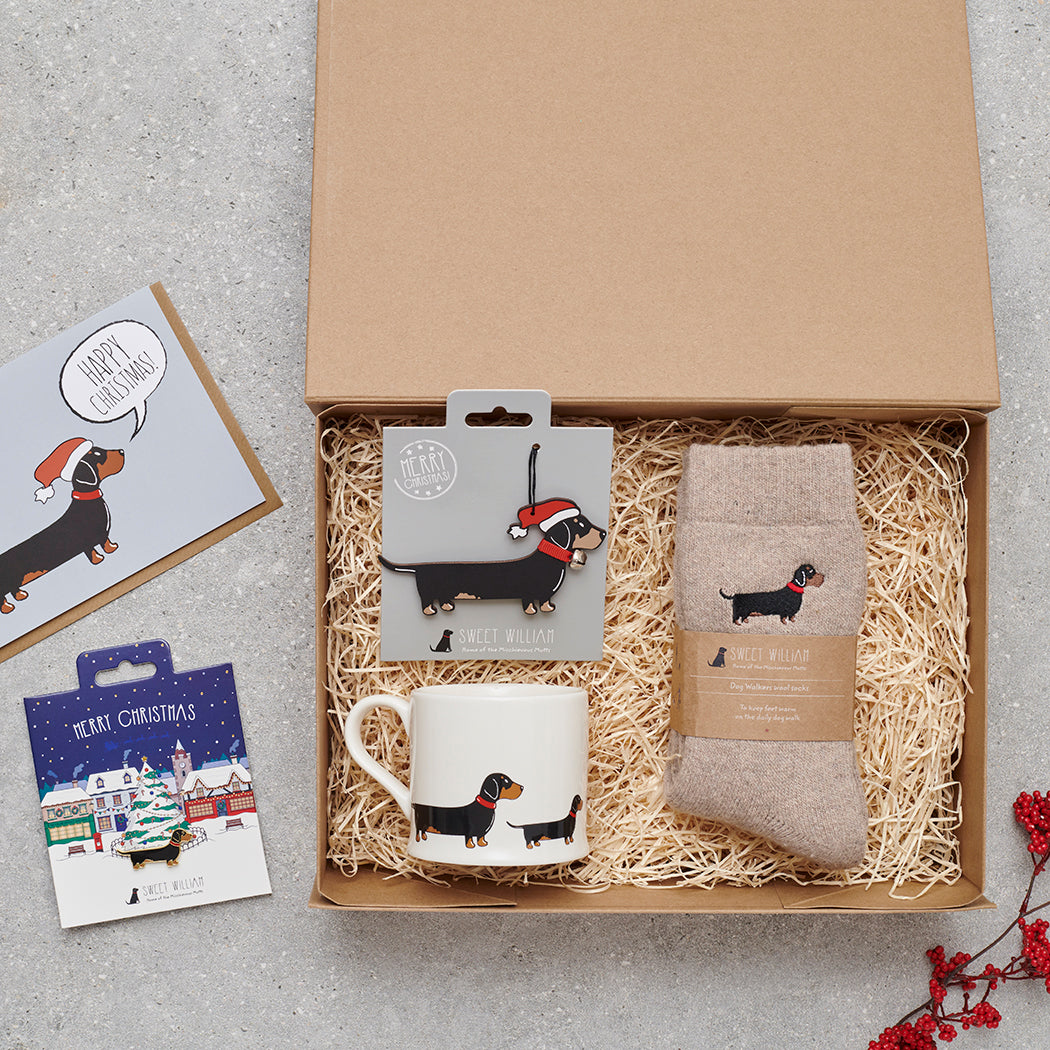 Dachshund Christmas gift hamper with a matching Dachshund Christmas pin, socks, mug, Christmas decoration and greeting card by Sweet William Designs