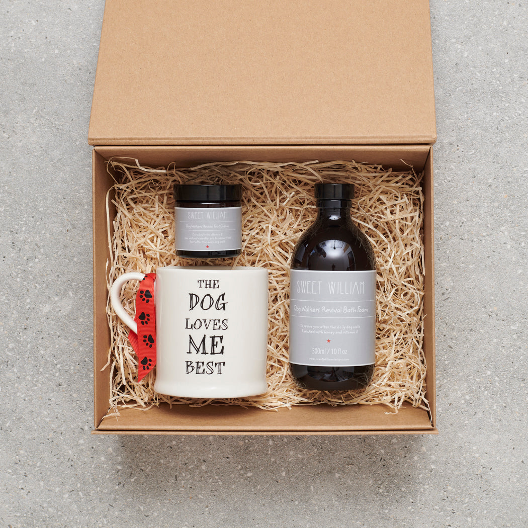 'The Dog Loves Me Best' mug in gift hamper with Sweet William Dog Walker Revival bath foam and foot cream — thoughtful gift set for dog lovers and dog walkers