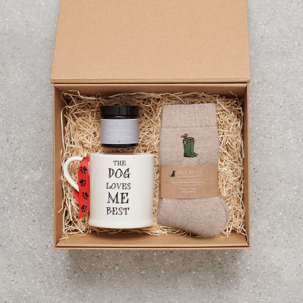 Wellies gardening socks in a gift hamper with Sweet William Designs 'The Dog Loves Me Best' mug and Dog Walker Revival foot cream — thoughtful gardening gift set for gardeners