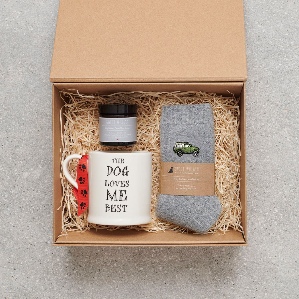 British 4x4 gift hamper with embroidered British 4x4 countryside vehicle wool socks, "The Dog Loves Me Best" mug, and Dog Walker Revival foot cream by Sweet William Designs