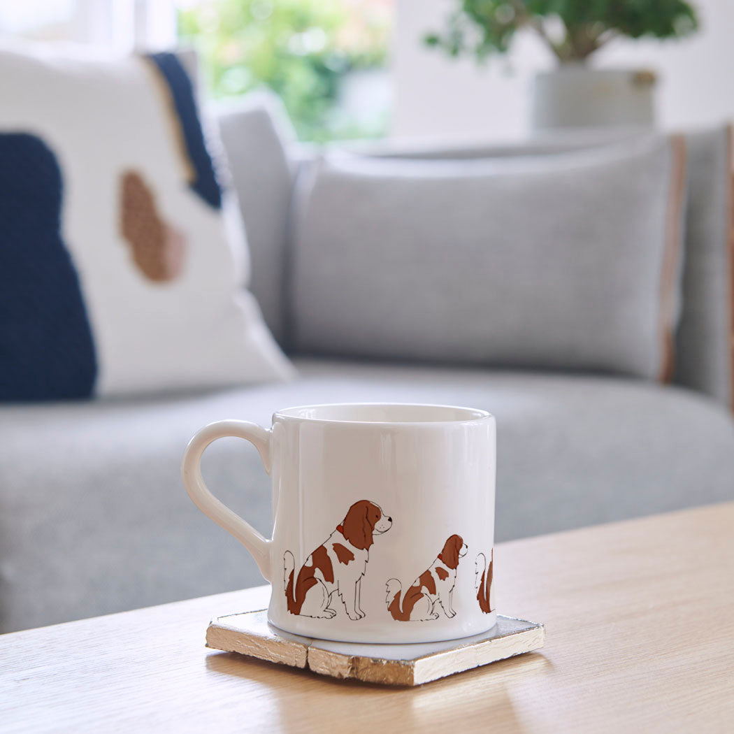 Cavalier King Charles Spaniel mug on coffee table — illustrated ceramic dog mug by Sweet William Designs