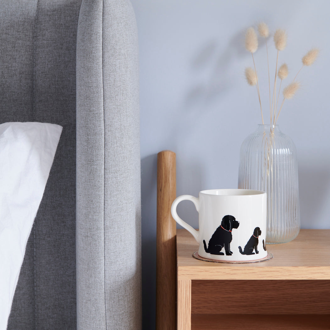 Sweet William Black Cockapoo Mug on a bedside table — Black Cockapoo dog lover gift mug