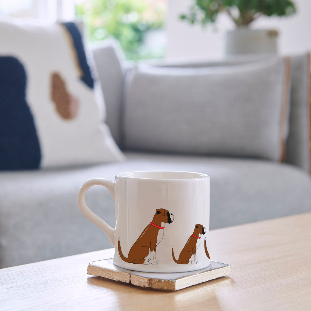 Sweet William Boxer Mug on a coffee table — illustrated repeat pattern ceramic mug