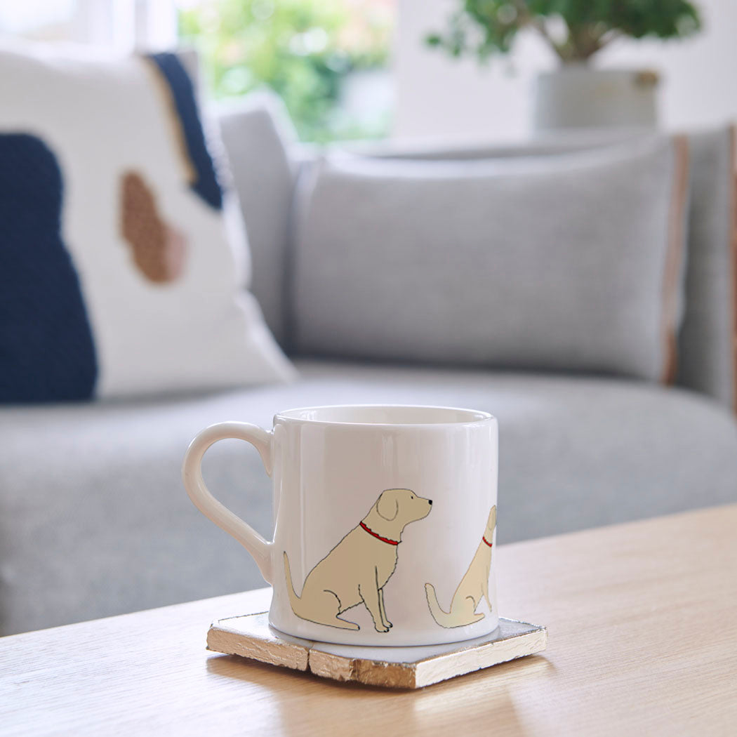 Sweet William Golden Retriever Mug on a coffee table — illustrated Golden Retriever repeat pattern ceramic mug
