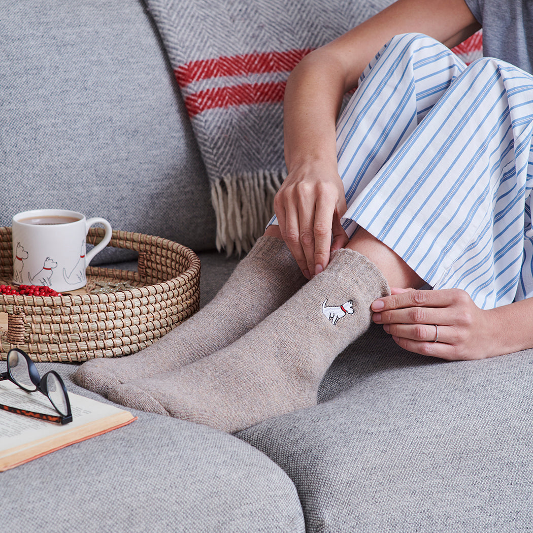 Relaxing in Westie dog walking socks — cosy wool blend socks, ideal gift for West Highland Terrier owners
