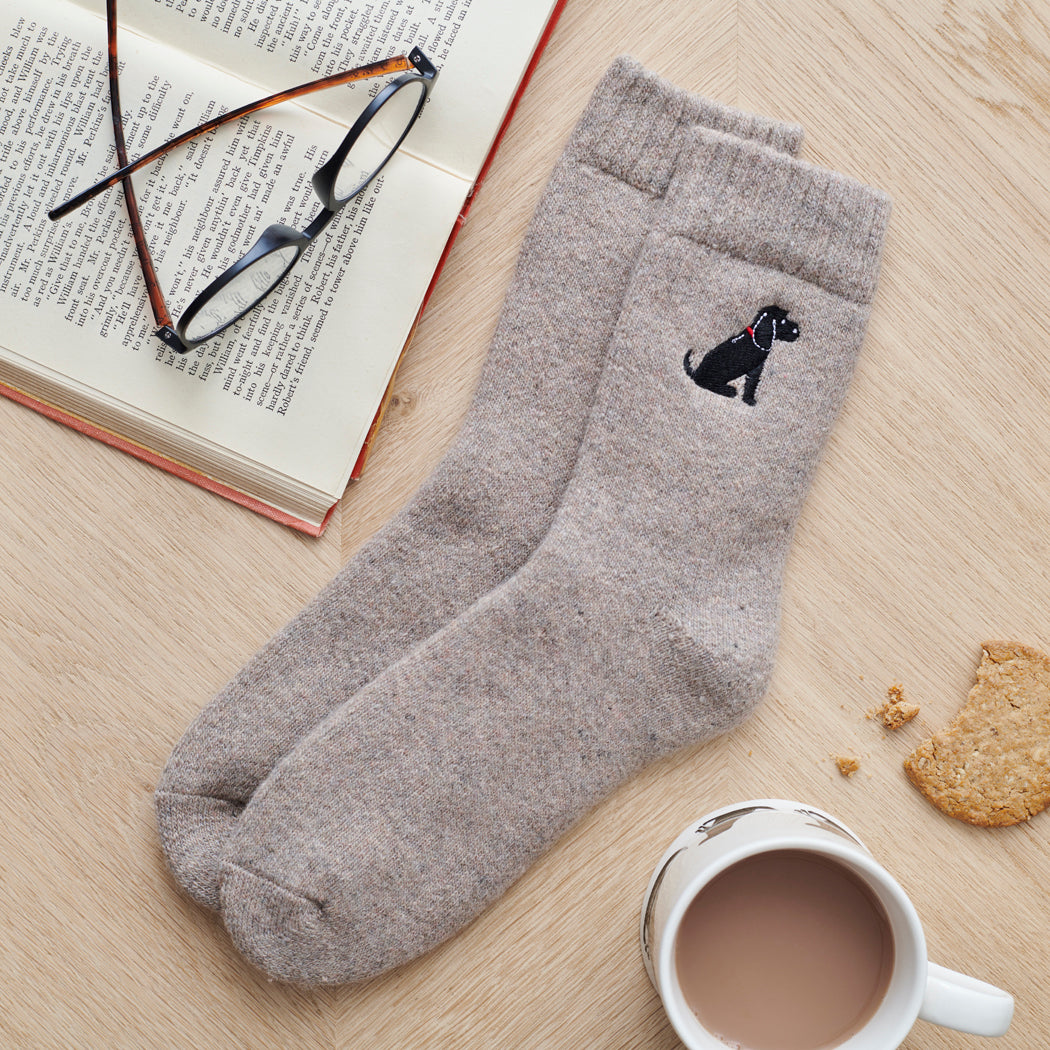 Black Cocker Spaniel socks laid flat — embroidered unisex wool blend socks, one size fits UK 3–12