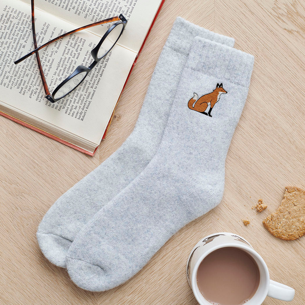 Fox embroidered wool socks laid flat with book, glasses and cup of tea — cosy fox lover gift by Sweet William Designs