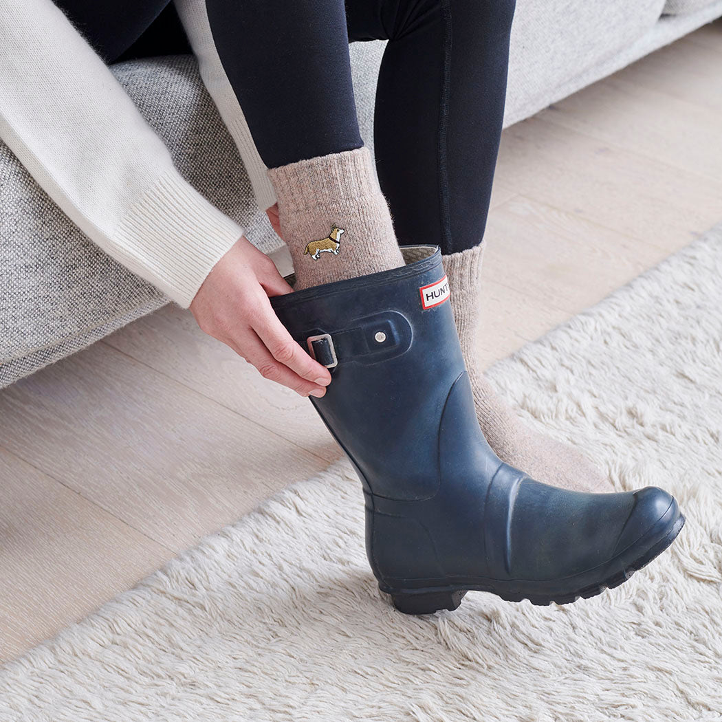 Corgi dog walking socks worn with wellies — perfect gift for dog walkers and countryside lovers