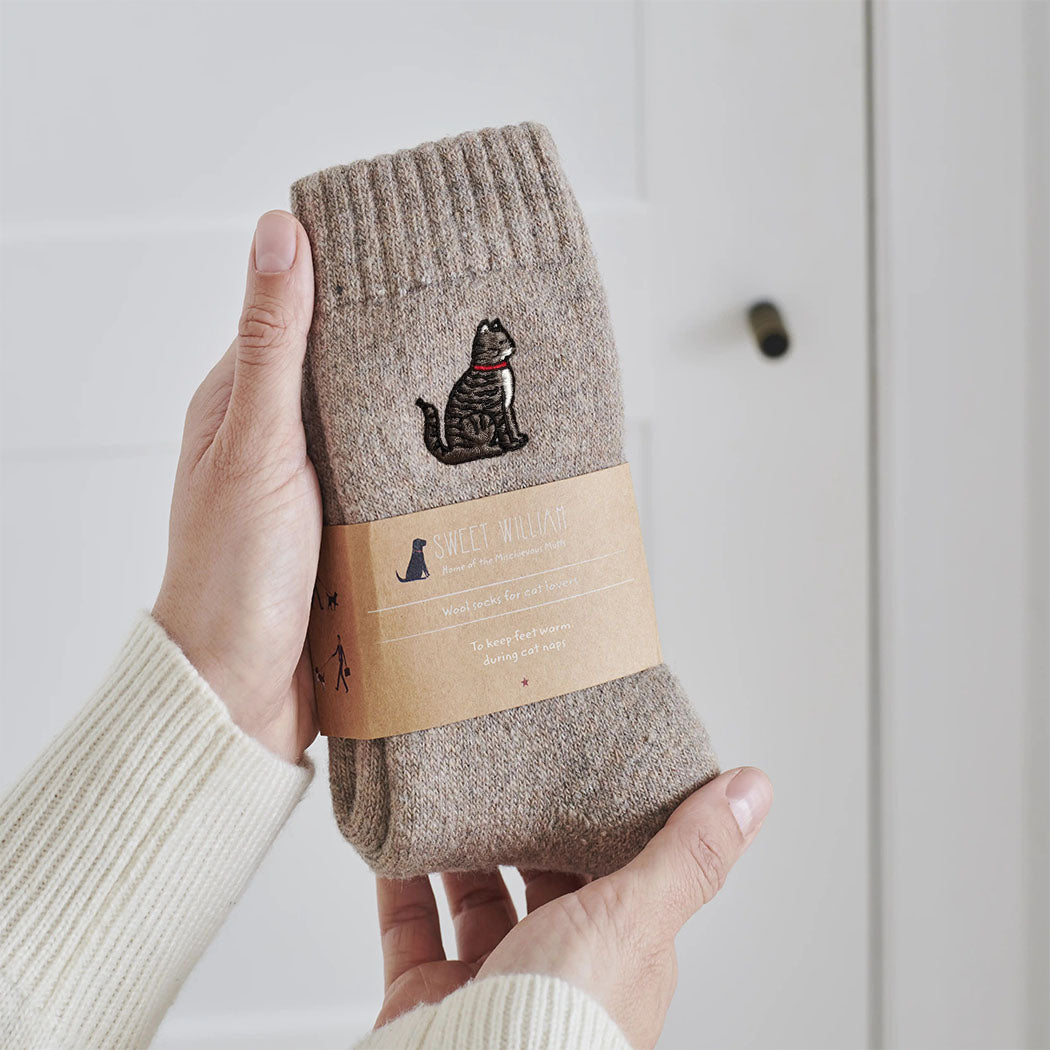 Tabby cat wool socks held in hands with Sweet William Designs branded band — soft wool blend cat lover gift