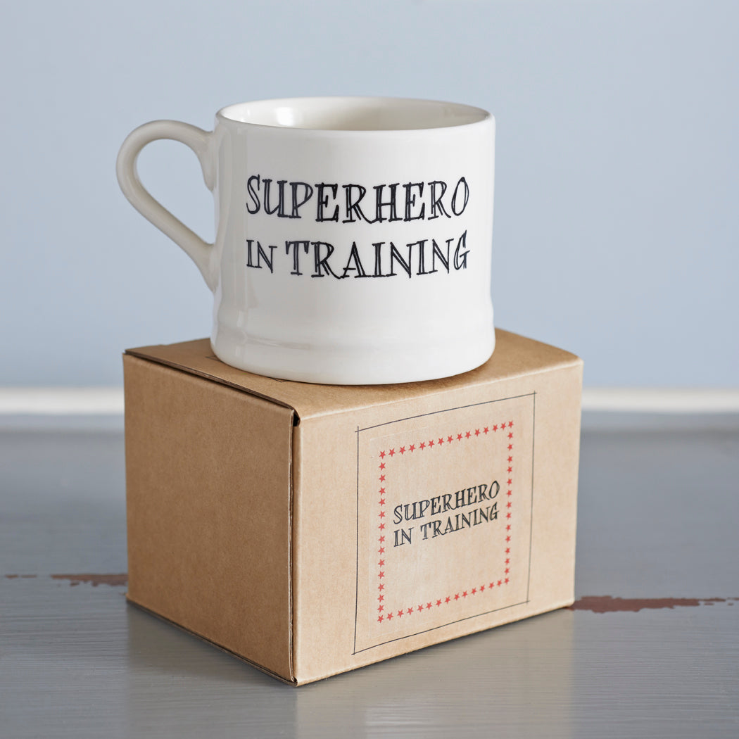 “Superhero in Training” mug presented on its kraft gift box, a perfect gift for a real-life superhero