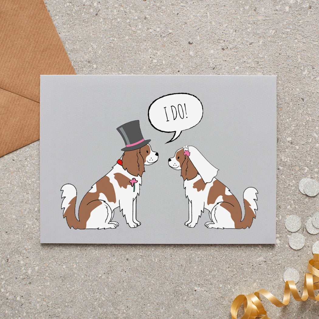 Cavalier King Charles Spaniel wedding card featuring a charming bride and groom with an ‘I DO!’ message, perfect for celebrating a dog-loving couple’s special day