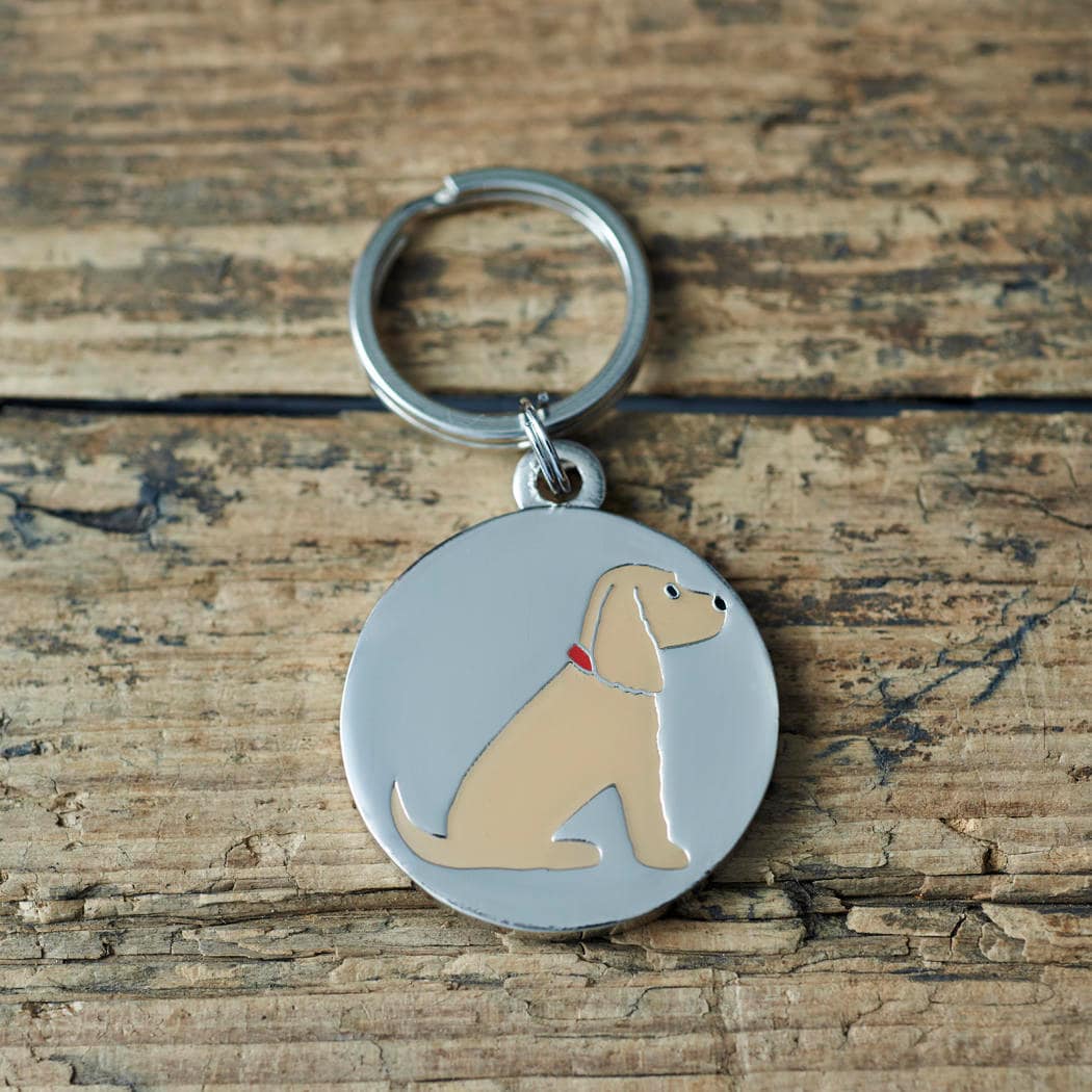 Close-up of Golden Cocker Spaniel dog ID tag — silver-plated brass with illustrated Golden Cocker Spaniel design, personalised dog tag by Sweet William Designs
