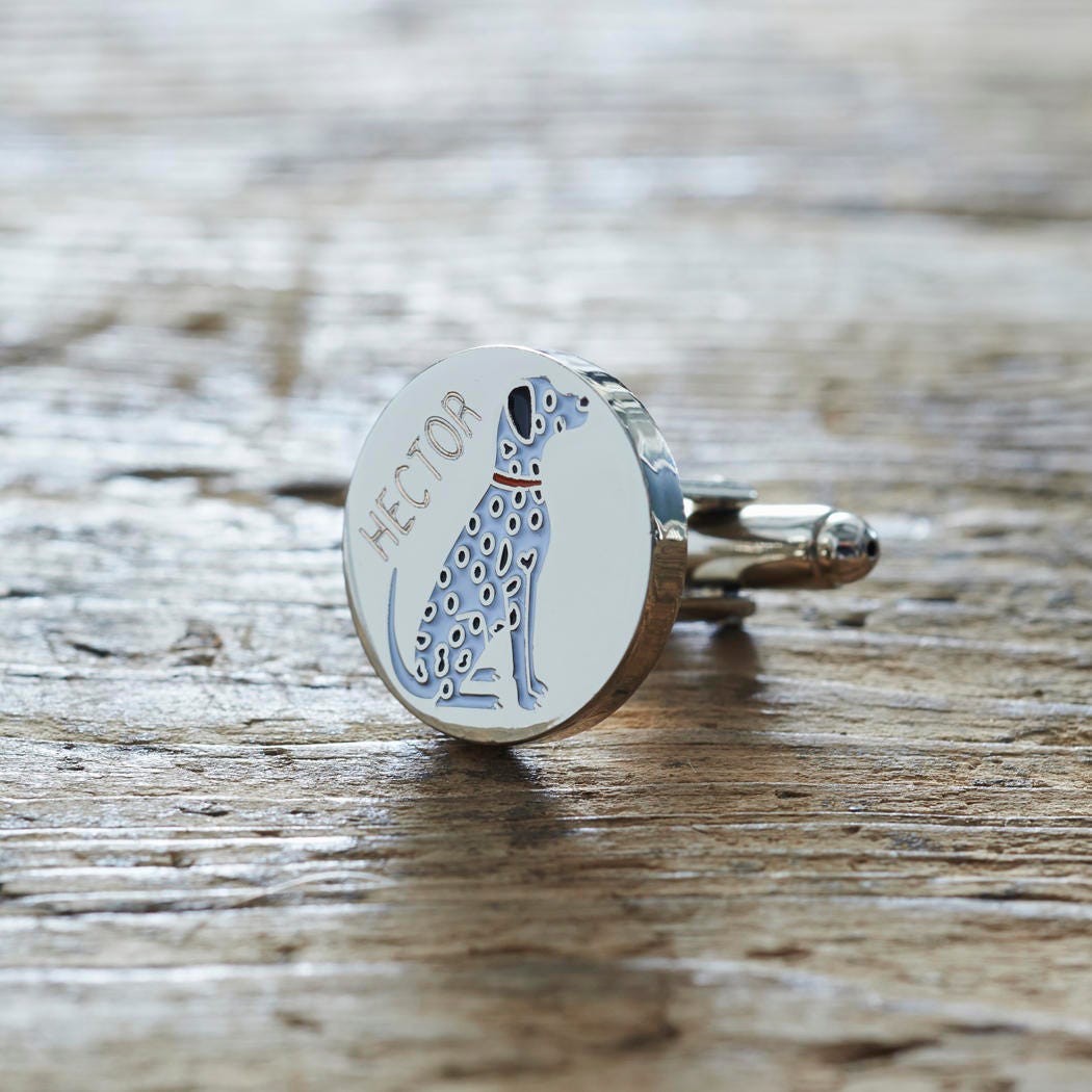 Close-up of personalised Dalmatian cufflink engraved with name on rustic wood — silver-plated gift for Dalmatian owners