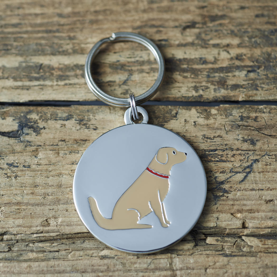 Close-up of Golden Retriever dog ID tag — silver-plated brass with illustrated Golden Retriever design, personalised dog tag by Sweet William Designs