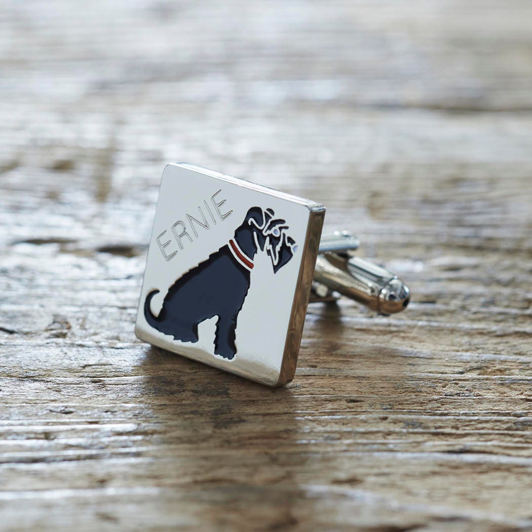 Close-up of personalised Black Schnauzer cufflink engraved with name on rustic wood — silver-plated gift for Black Schnauzer owners