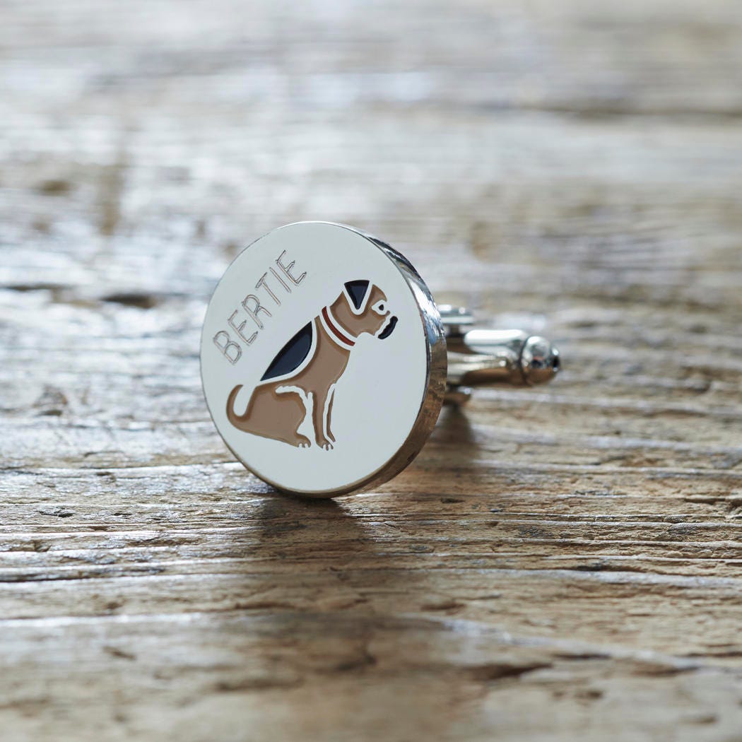 Close-up of personalised Border Terrier cufflink engraved with name on rustic wood — silver-plated gift for Border Terrier owners