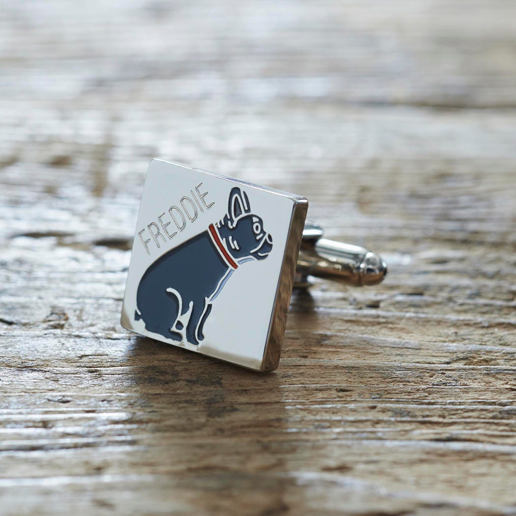 Close-up of personalised French Bulldog cufflink engraved with name on rustic wood — silver-plated gift for French Bulldog owners