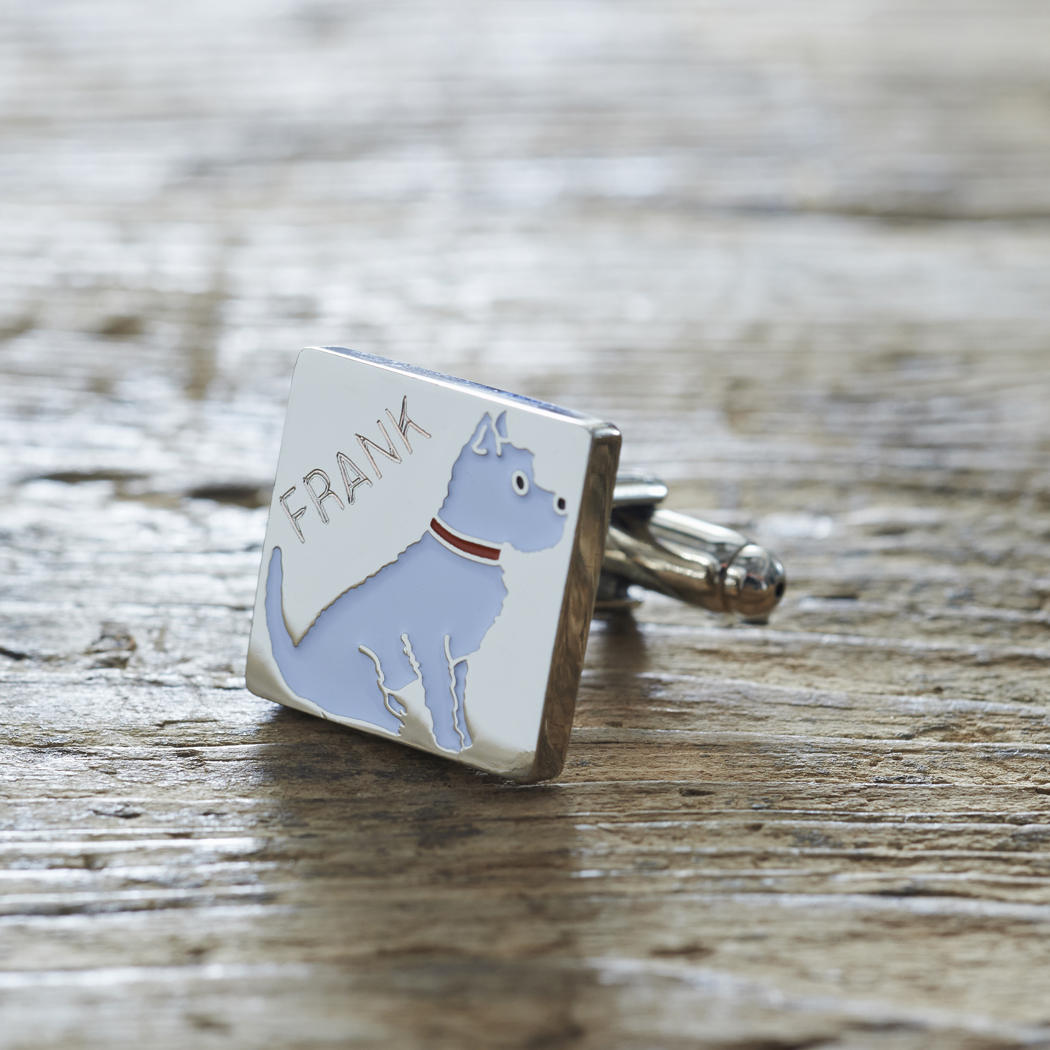 Close-up of personalised Westie cufflink engraved with name on rustic wood — silver-plated gift for Westie owners